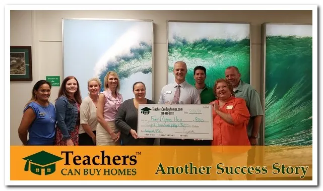 Principal Butz with Fort Myers high Accepts another donation!